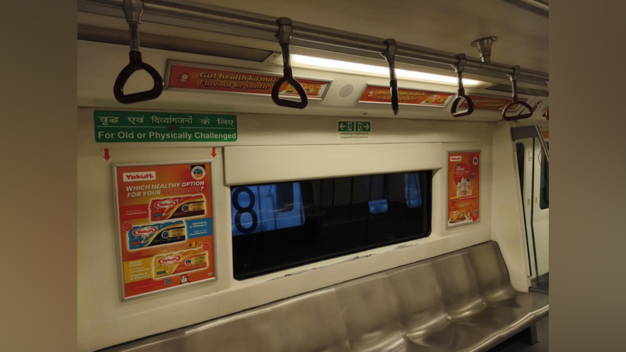 a subway train with a window and a sign