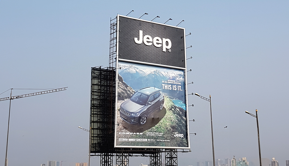 Jeep billboard showcasing the Compass SUV with the slogan "This is it."